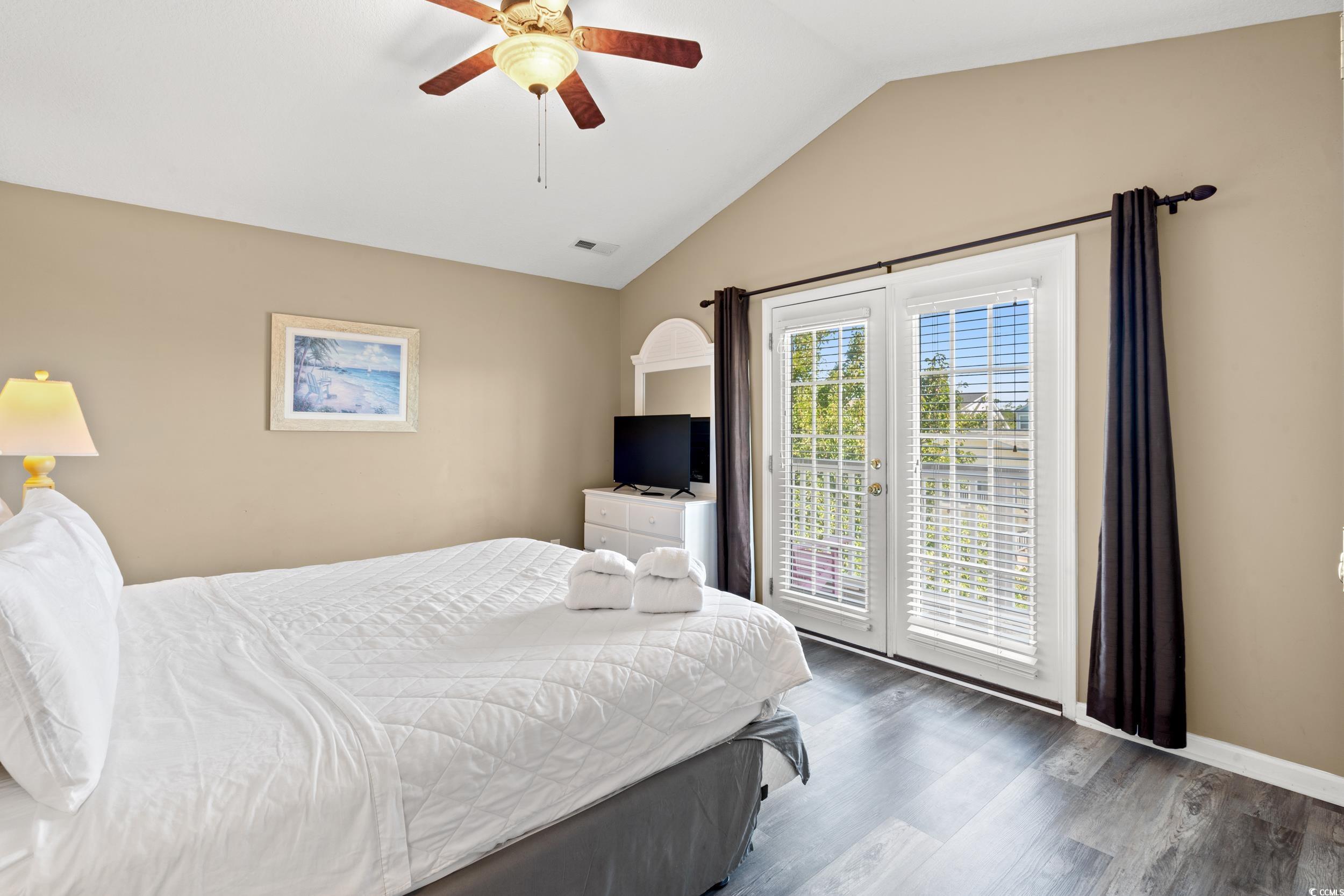 113 B 15th Avenue South Surfside Beach, SC 29575 - Photo 13 of 40 Bedroom featuring wood finished floors, lofted ceiling, access to outside, and a ceiling fan