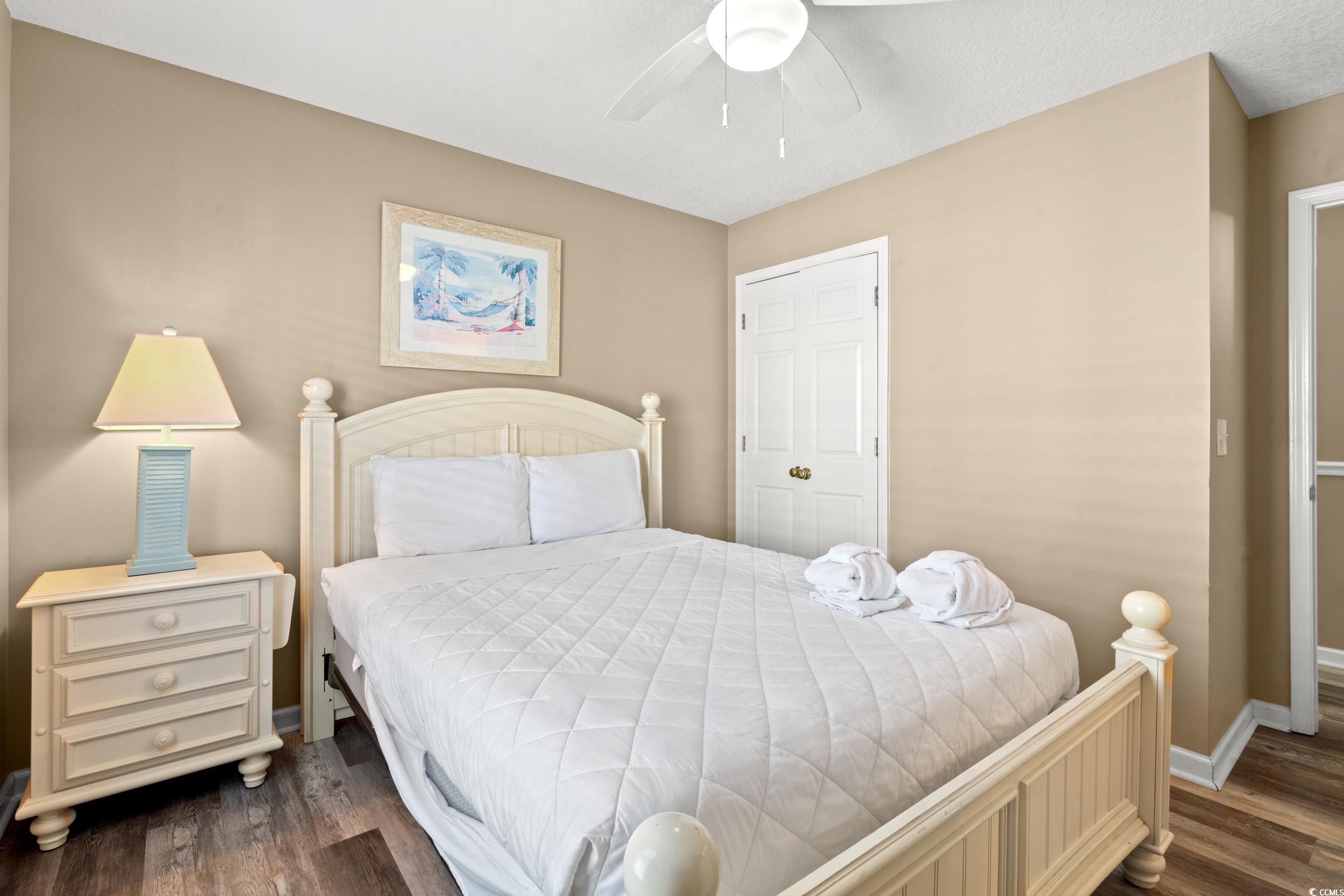113 B 15th Avenue South Surfside Beach, SC 29575 - Photo 20 of 40 Bedroom featuring dark wood-style flooring and ceiling fan