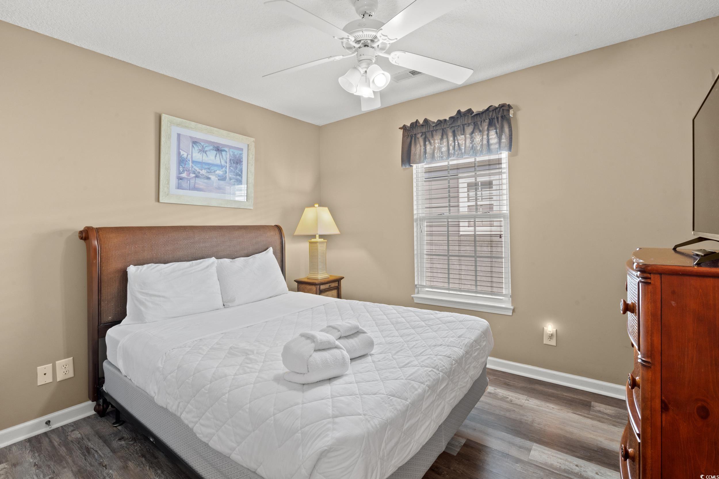 113 B 15th Avenue South Surfside Beach, SC 29575 - Photo 23 of 40 Bedroom with dark wood-style flooring and ceiling fan