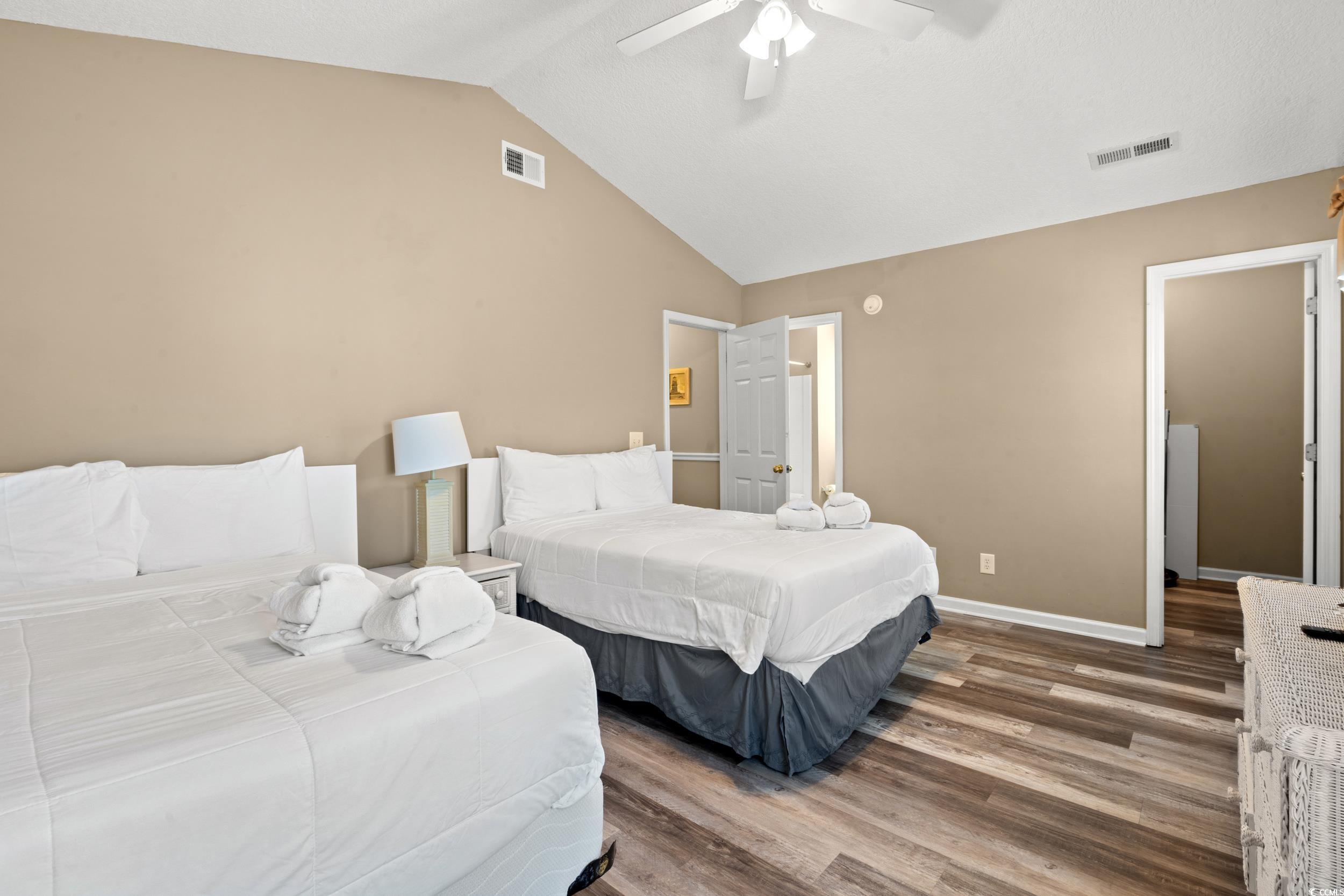 113 B 15th Avenue South Surfside Beach, SC 29575 - Photo 26 of 40 Bedroom featuring wood finished floors, lofted ceiling, and ceiling fan