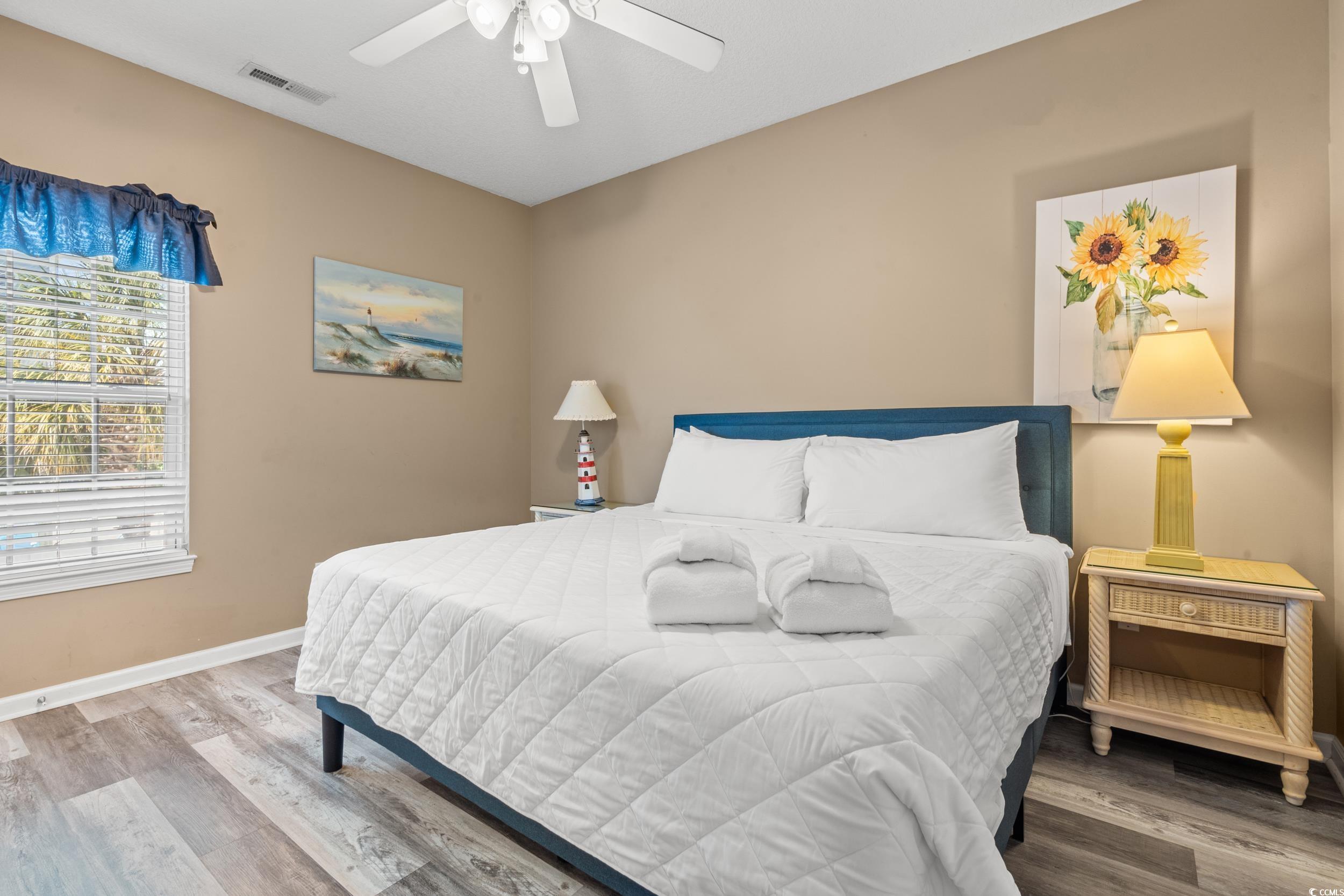 113 B 15th Avenue South Surfside Beach, SC 29575 - Photo 31 of 40 Bedroom with wood finished floors and a ceiling fan