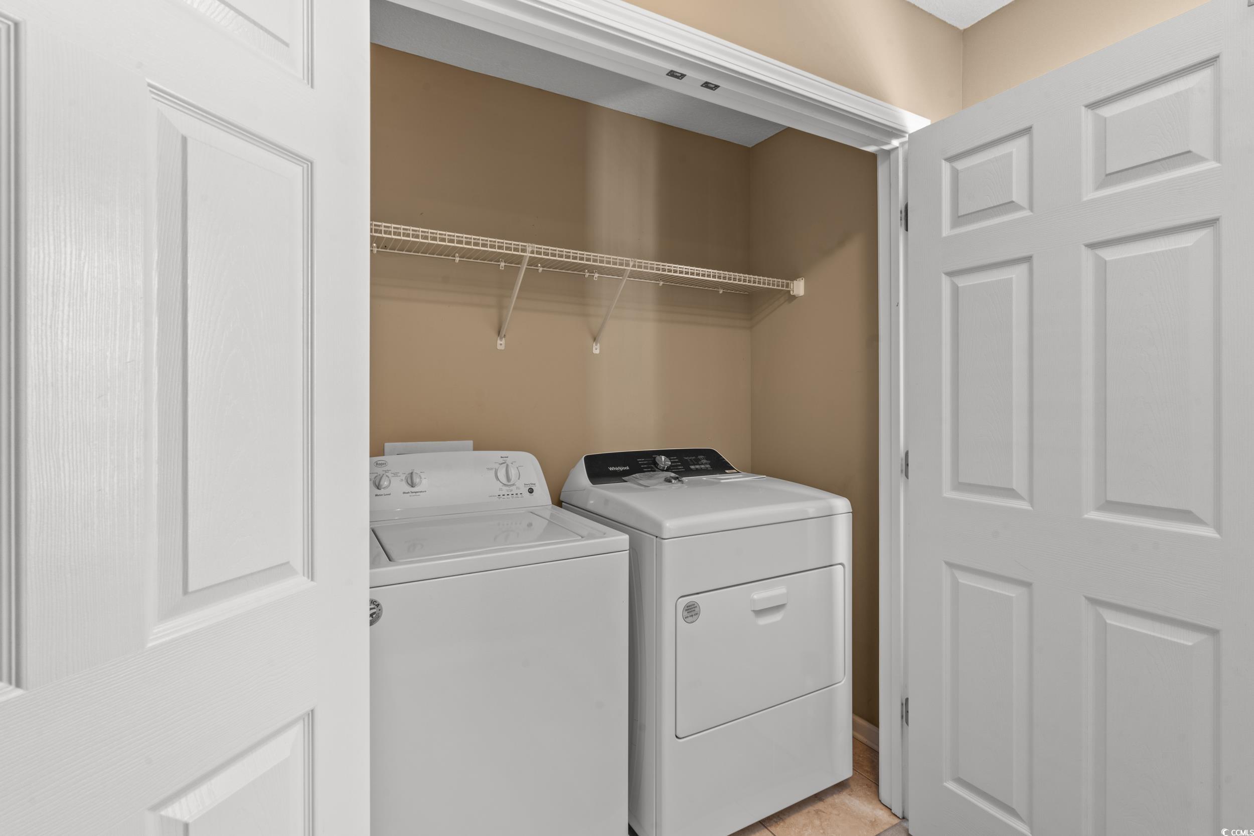 113 B 15th Avenue South Surfside Beach, SC 29575 - Photo 33 of 40 Washroom featuring washer and clothes dryer and light tile patterned flooring