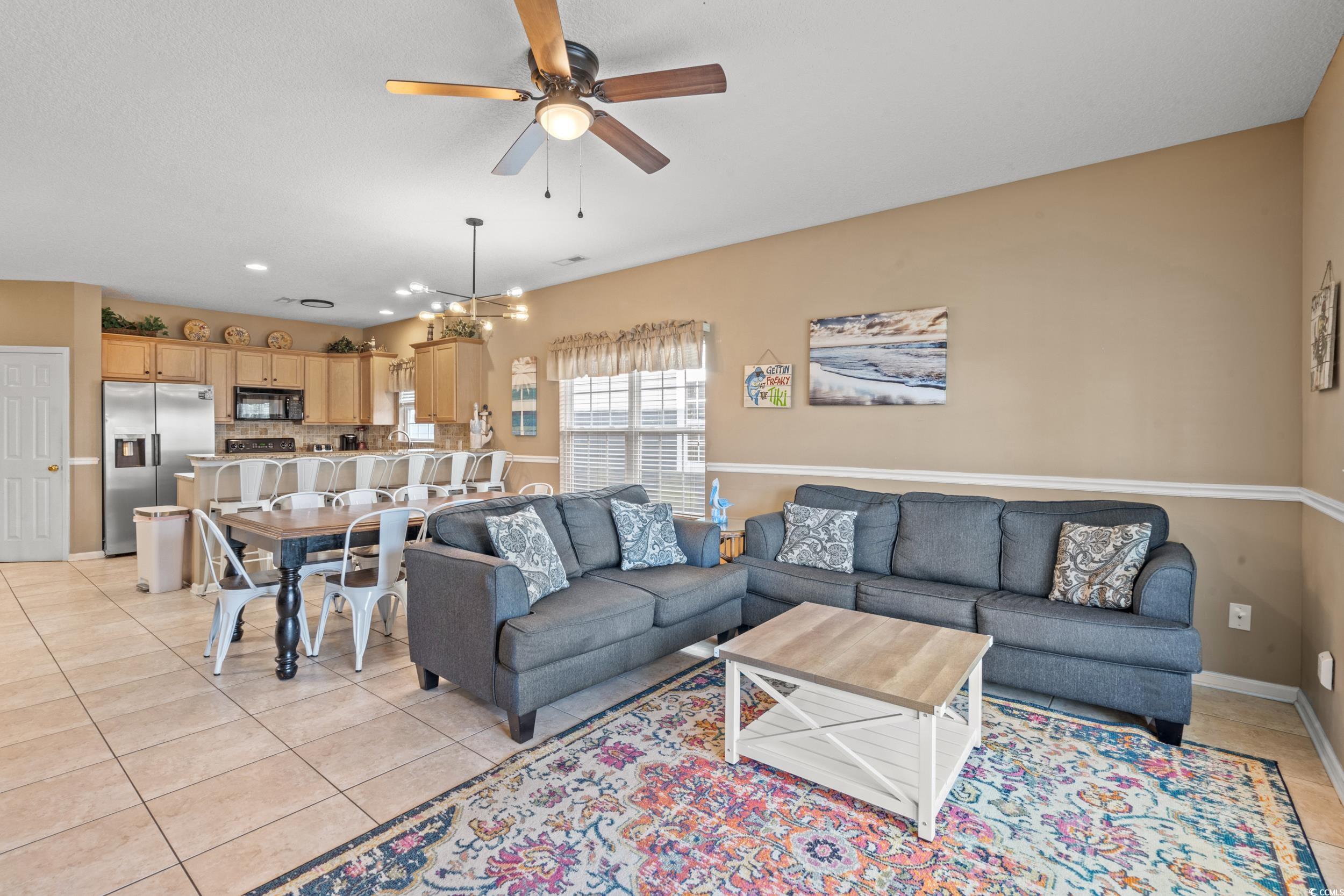 113 B 15th Avenue South Surfside Beach, SC 29575 - Photo 10 of 40 Living area with light tile patterned floors, ceiling fan, a chandelier, and recessed lighting