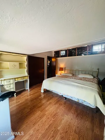 a bedroom with a bed and a view of bedroom