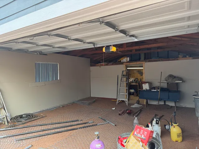 a storage room with lots of clutter and furniture