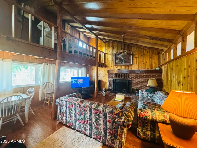 a bedroom with furniture and a fireplace
