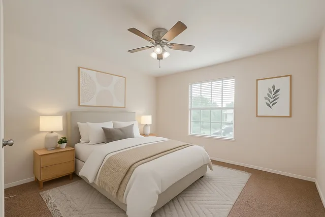 a bedroom with a bed and window