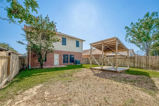 a view of a house with a yard and plants