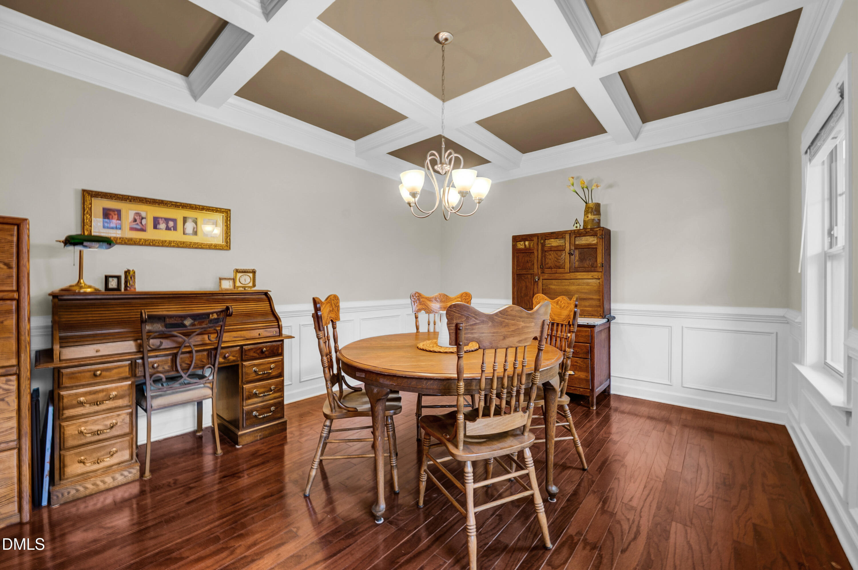 8621 Jordan Meadow Drive Fuquay-Varina, NC 27526 - Photo 6 of 55 a view of a dining room with furniture and wooden floor
