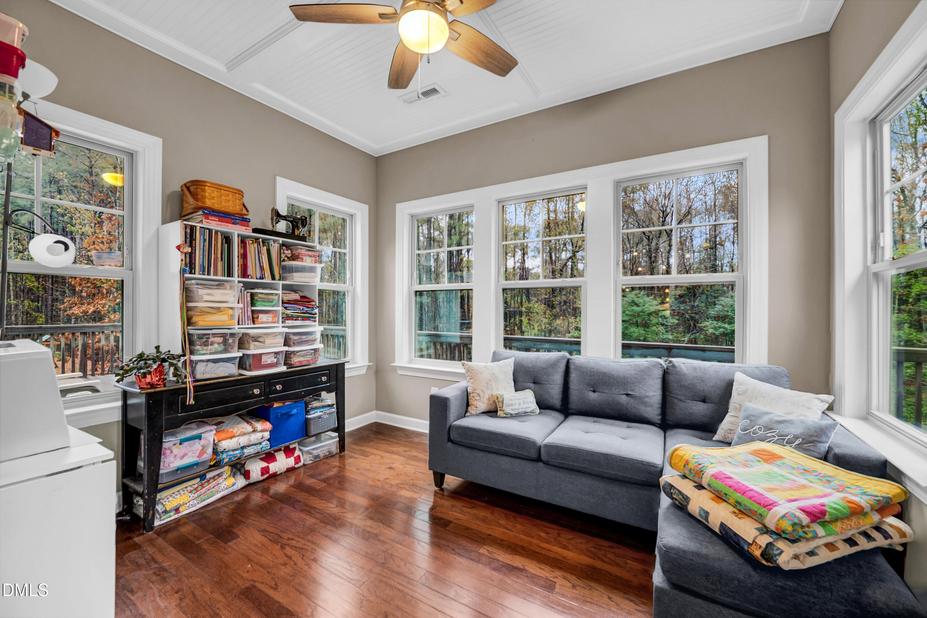 8621 Jordan Meadow Drive Fuquay-Varina, NC 27526 - Photo 16 of 55 a living room with furniture and a floor to ceiling window