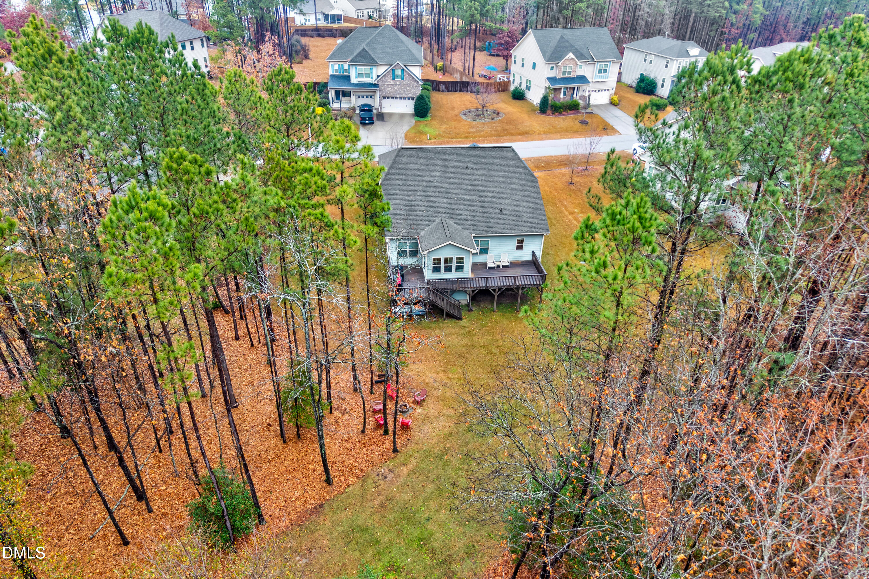 8621 Jordan Meadow Drive Fuquay-Varina, NC 27526 - Photo 40 of 55 an aerial view of residential houses with outdoor space and trees