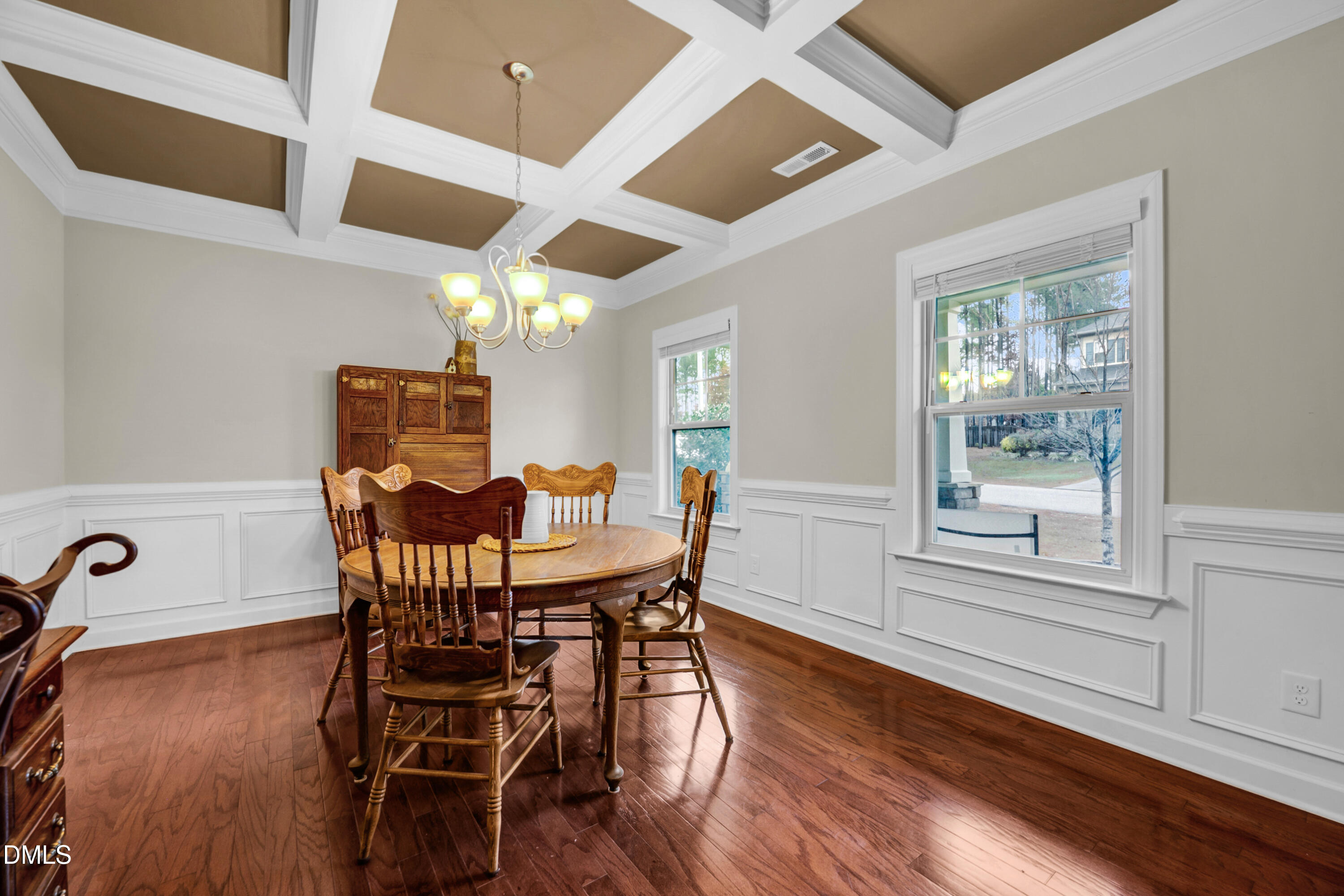 8621 Jordan Meadow Drive Fuquay-Varina, NC 27526 - Photo 5 of 55 a view of a dining room with furniture and wooden floor