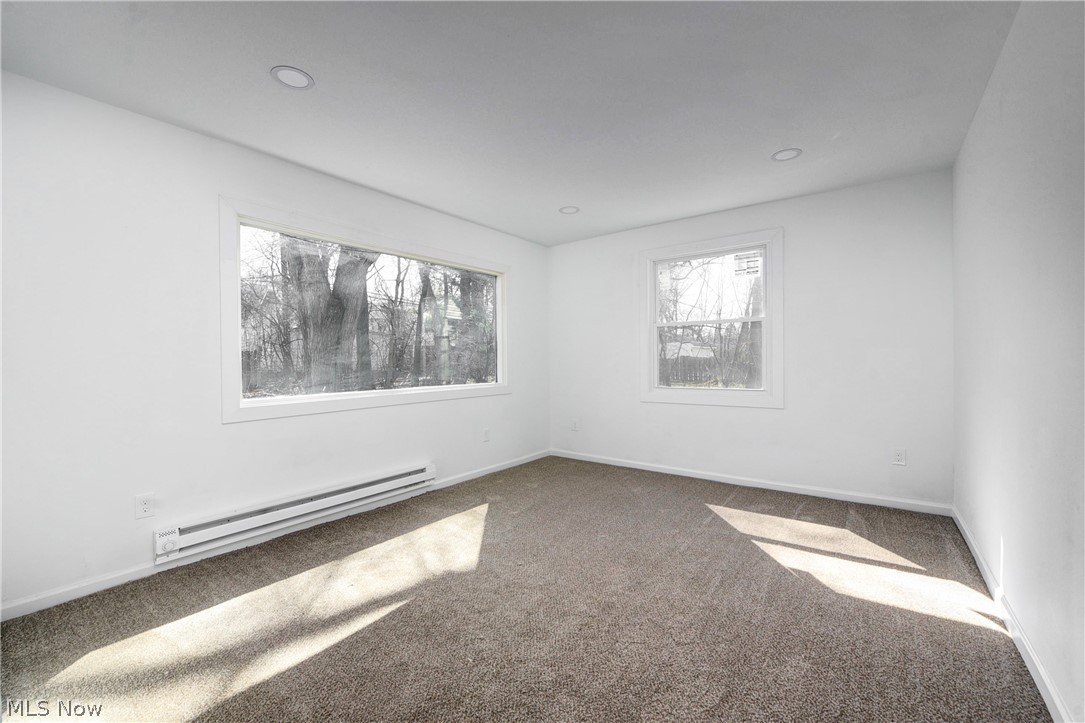 3164 Whitethorn Road Cleveland, OH 44118 - Photo 12 of 31 Carpeted empty room featuring a baseboard radiator