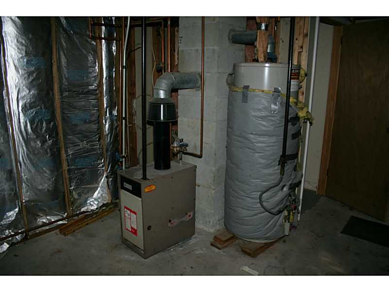 12 Weathervane Way Westerly, RI 02808 - Photo 19 of 20 Cellar or Basement. Utility room in basement - gas furnace & hot water tank