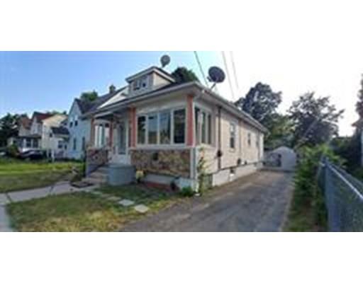 36 Barber Street Springfield, MA 01109 - Photo 3 of 15 a view of house with yard and sitting area