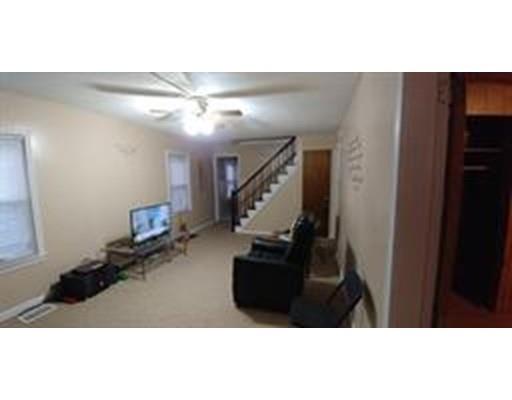 36 Barber Street Springfield, MA 01109 - Photo 6 of 15 a living room with furniture and stairs