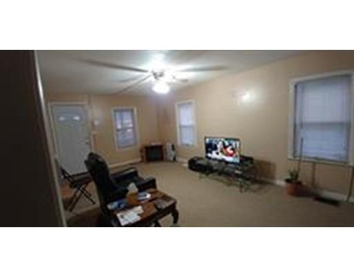 36 Barber Street Springfield, MA 01109 - Photo 7 of 15 a living room with furniture and a chandelier