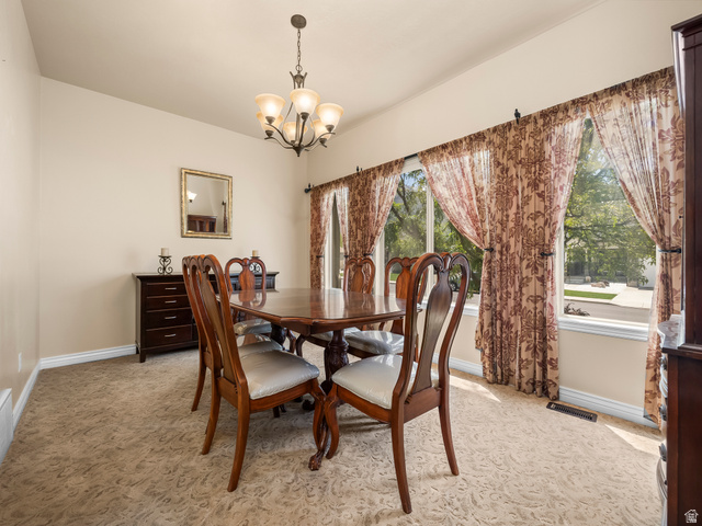 255 East 1200 North Mapleton, UT 84664 - Photo 9 of 37 Dining area featuring patterned carpet and multiple windows