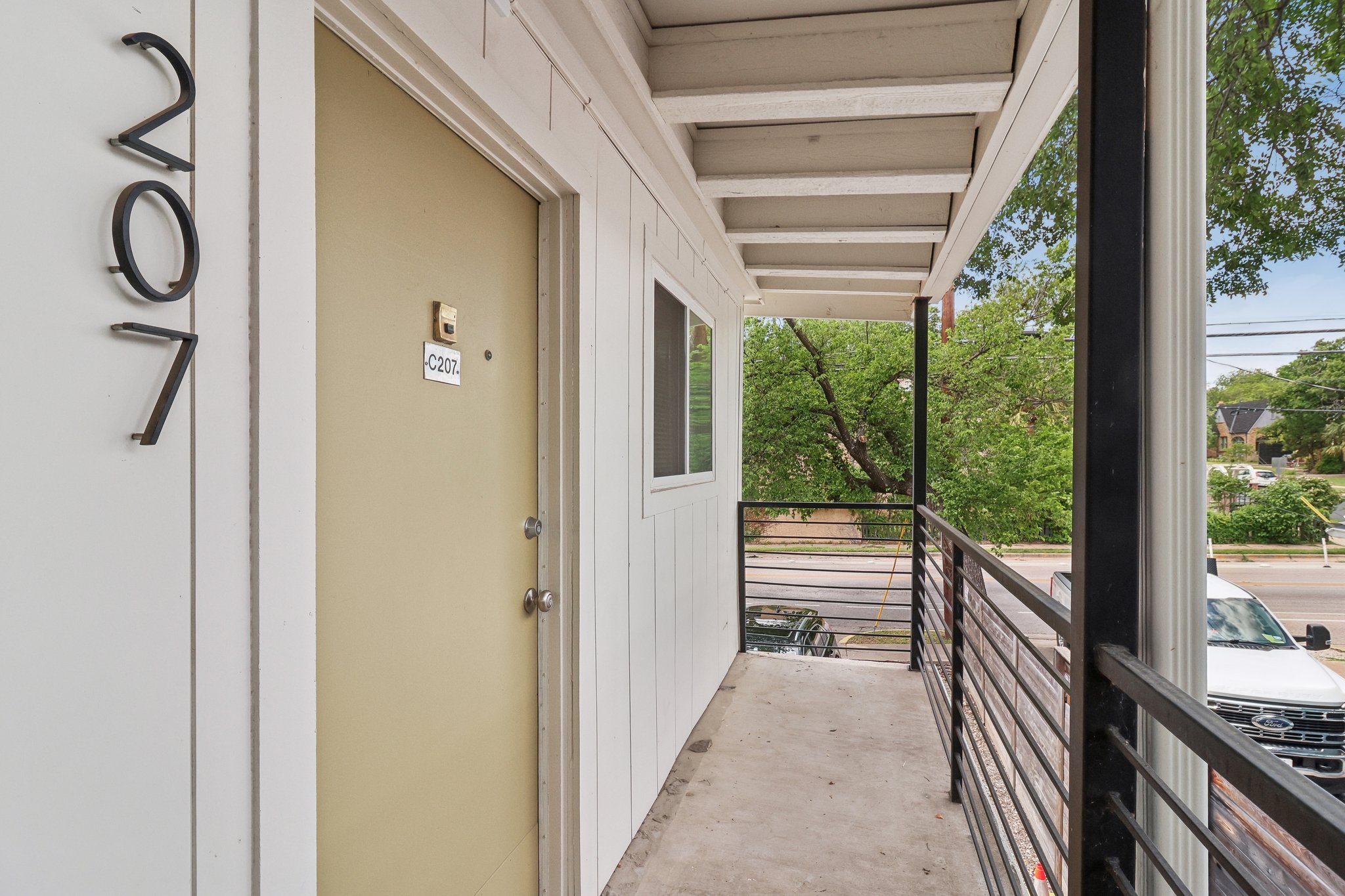 3107 Speedway, Unit 207 Austin, TX 78705 - Photo 10 of 12 a view of balcony and floor to ceiling window