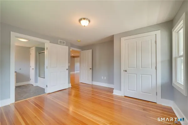 a view of gallery with wooden floor
