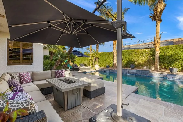 a view of an outdoor sitting area with furniture
