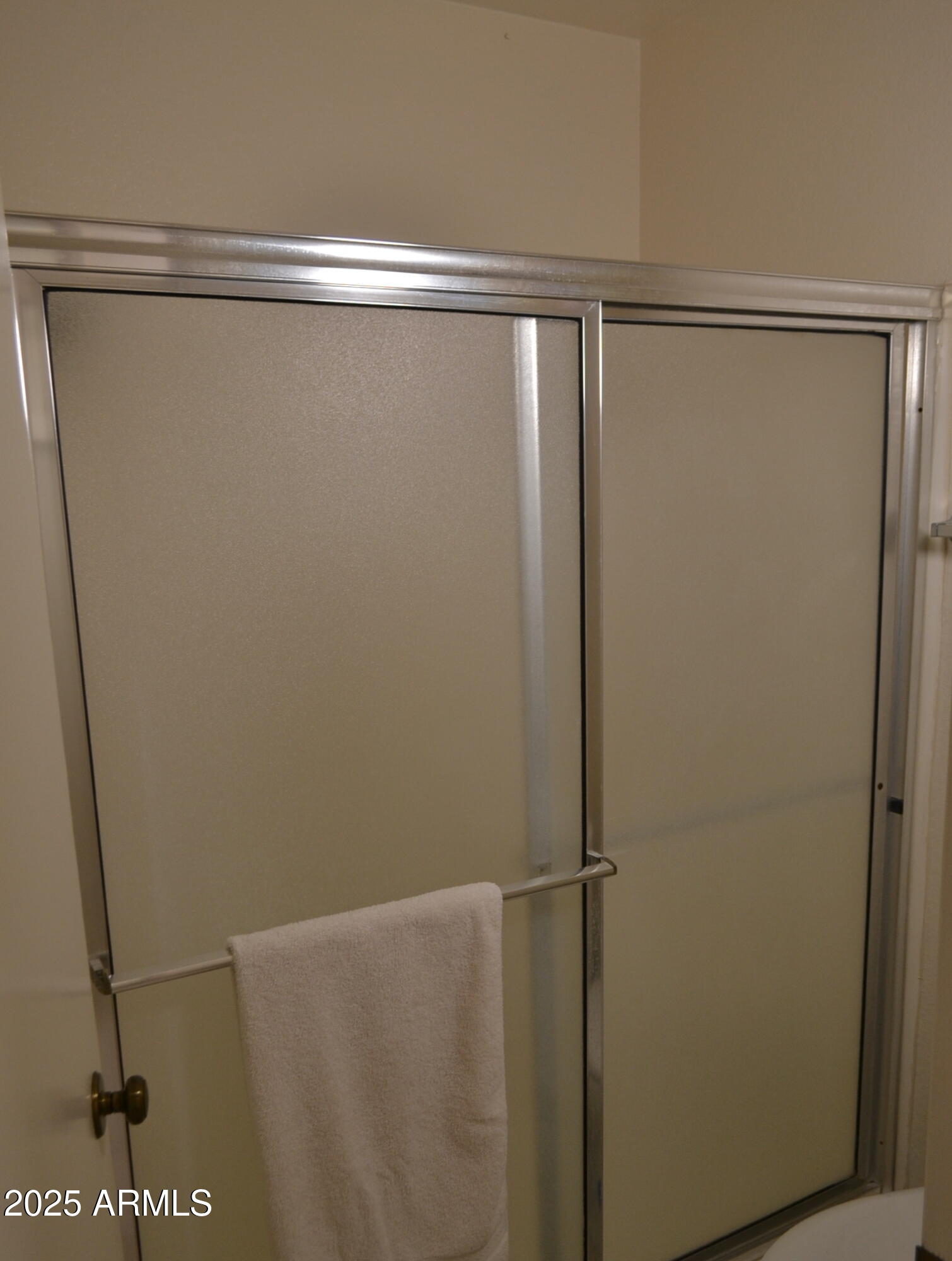 455 South Delaware Drive, Unit 112 Apache Junction, AZ 85120 - Photo 15 of 16 a bathroom with a glass shower door