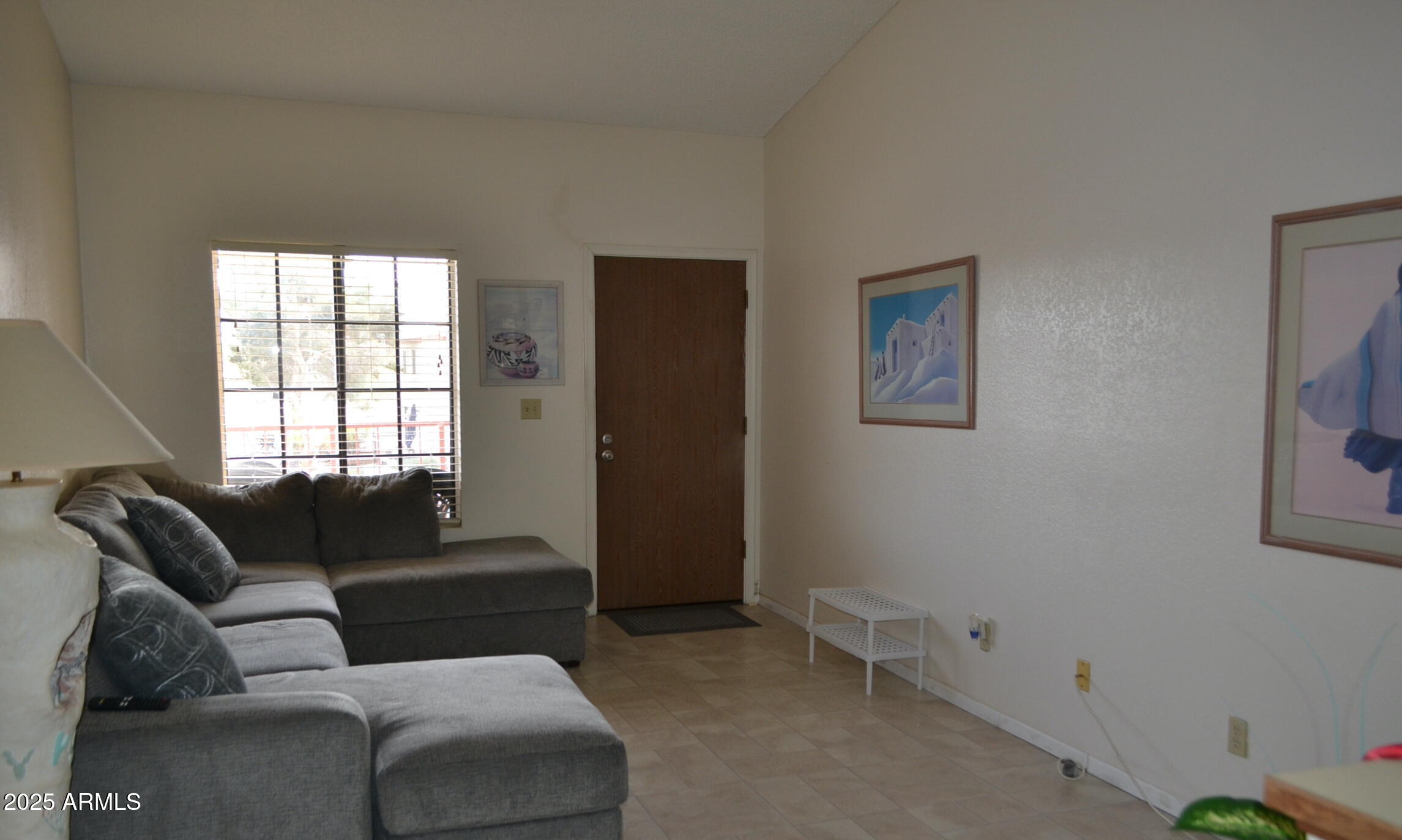 455 South Delaware Drive, Unit 112 Apache Junction, AZ 85120 - Photo 3 of 16 a living room with furniture and a window