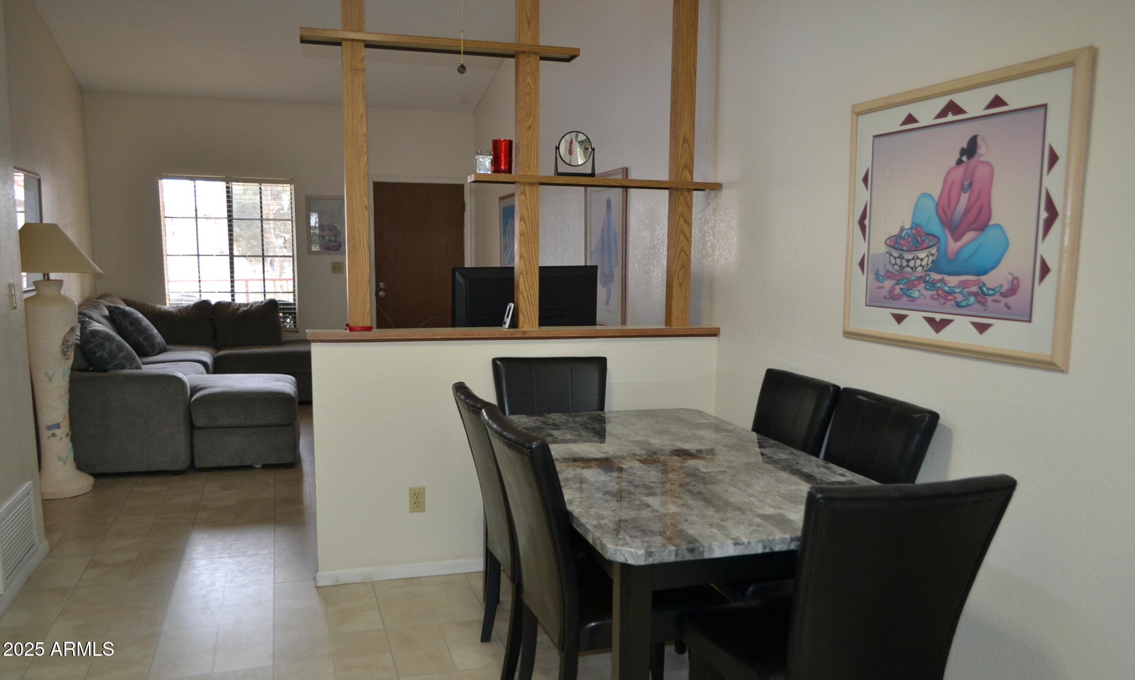 455 South Delaware Drive, Unit 112 Apache Junction, AZ 85120 - Photo 4 of 16 a living room with furniture and a painting on the wall
