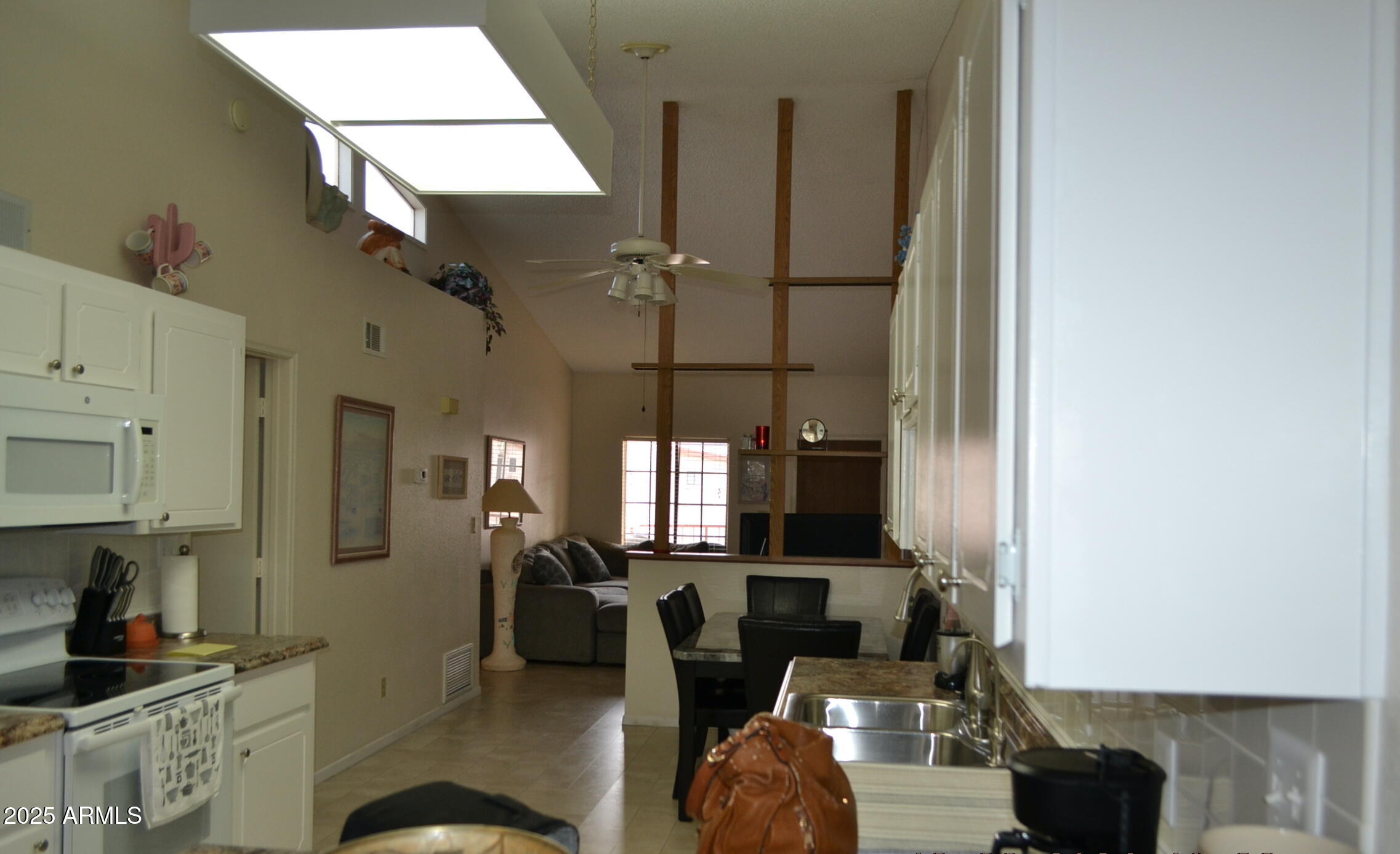 455 South Delaware Drive, Unit 112 Apache Junction, AZ 85120 - Photo 5 of 16 a very nice looking living room with a chair and potted plants