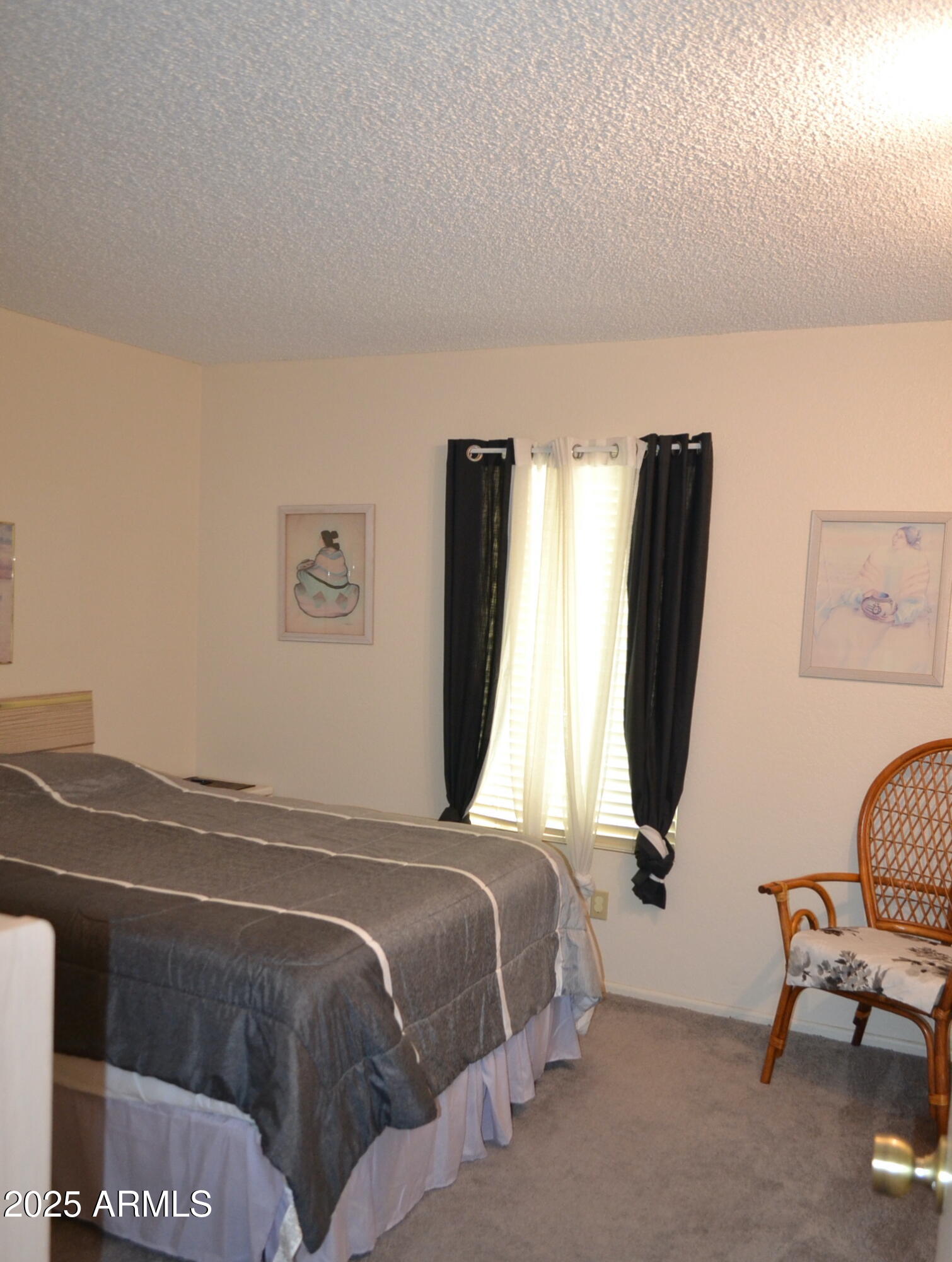 455 South Delaware Drive, Unit 112 Apache Junction, AZ 85120 - Photo 9 of 16 a bedroom with a bed a desk and chair