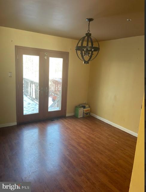 3516 Corn Stream Road Randallstown, MD 21133 - Photo 26 of 66 an empty room with wooden floor and windows