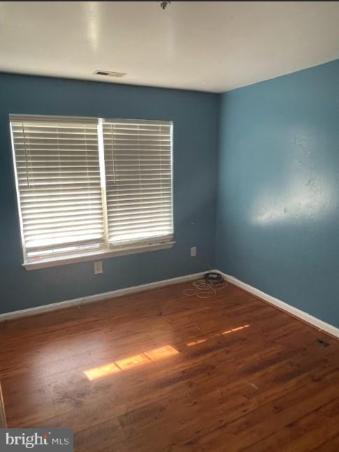 3516 Corn Stream Road Randallstown, MD 21133 - Photo 50 of 66 a view of an empty room with wooden floor and a window