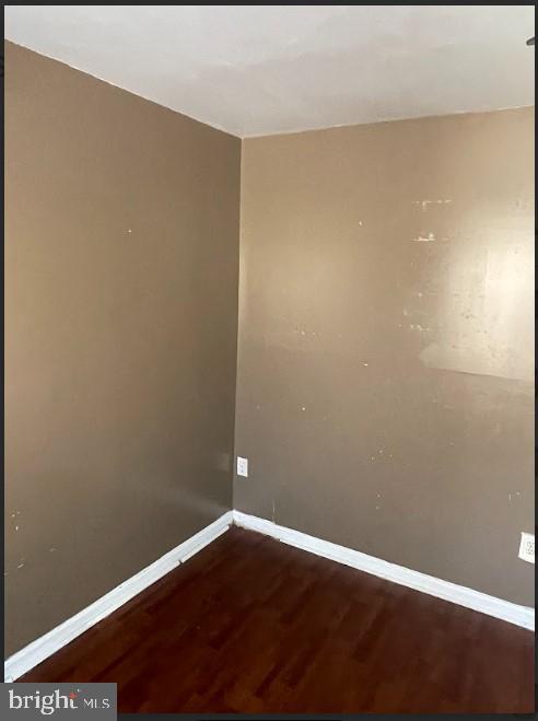 3516 Corn Stream Road Randallstown, MD 21133 - Photo 52 of 66 a view of an empty room with wooden floor