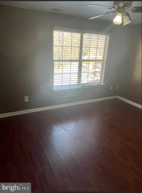 3516 Corn Stream Road Randallstown, MD 21133 - Photo 57 of 66 an empty room with wooden floor and windows