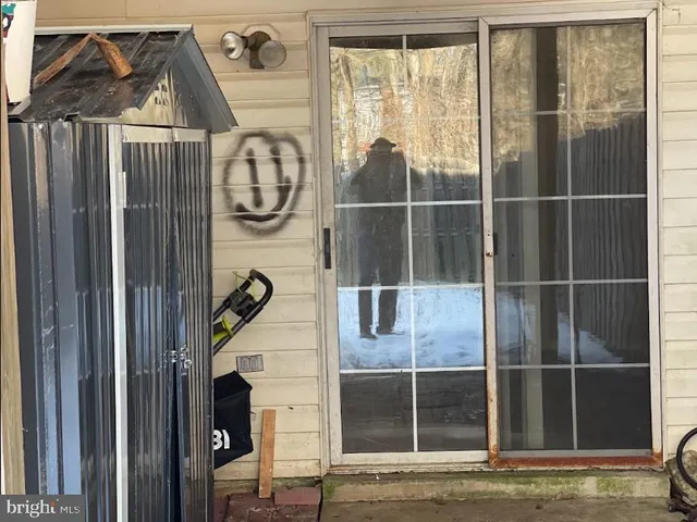 a view of a backyard with wooden fence