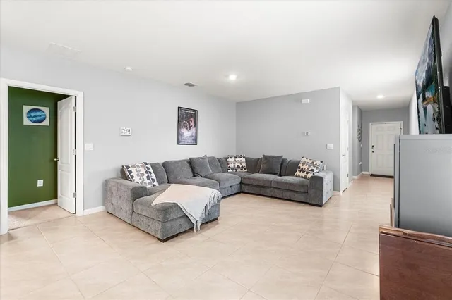 a living room with furniture and a couch