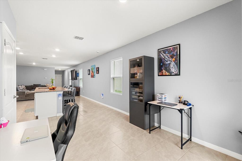6895 Botanic Boulevard Harmony, FL 34773 - Photo 14 of 31 a view of a workspace with furniture and a workspace