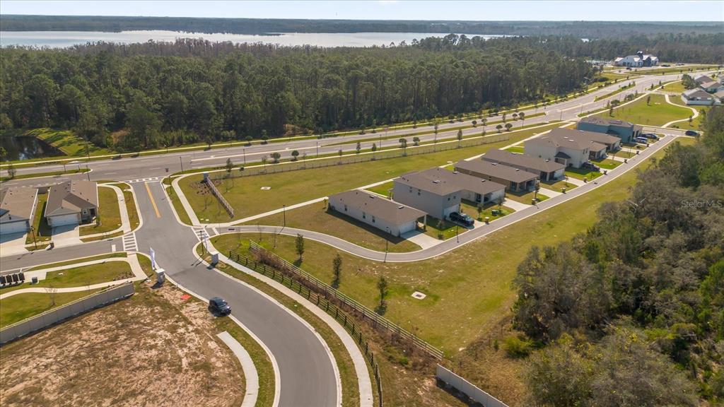 6895 Botanic Boulevard Harmony, FL 34773 - Photo 26 of 31 a view of a swimming pool with a lake view and mountain view