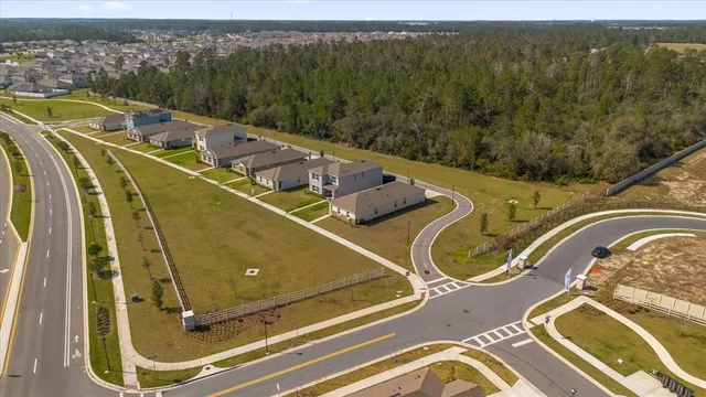 an aerial view of a house with a ocean view