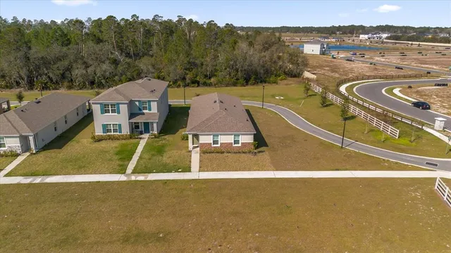 a view of a swimming pool with a yard