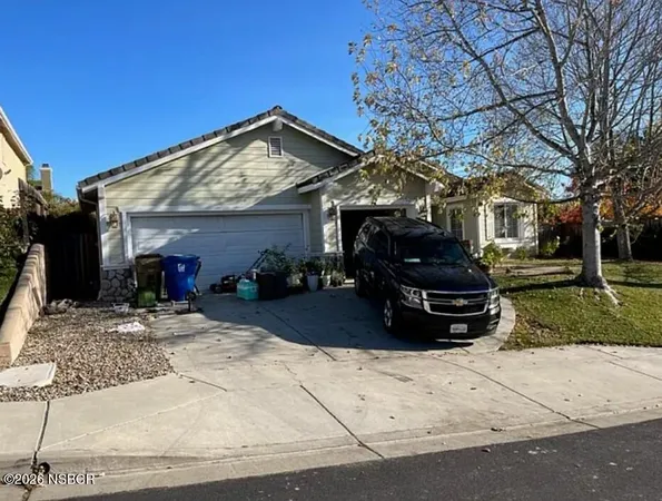 a view of a house with a snow in the yard