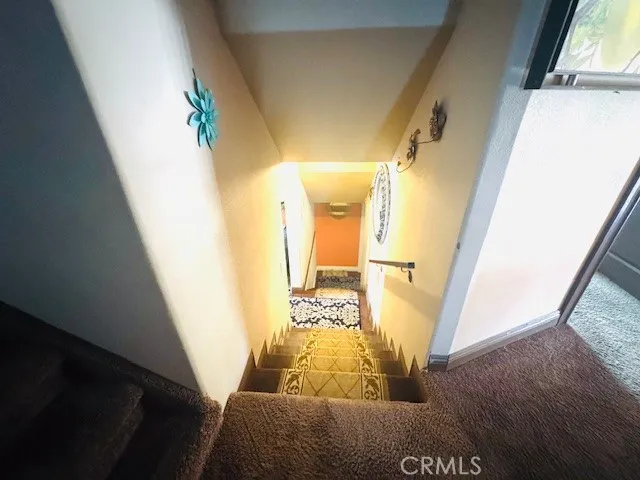 a view of a lake with couches and wooden floor