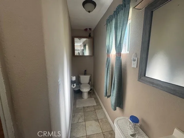 a bed room with a bed and a chair