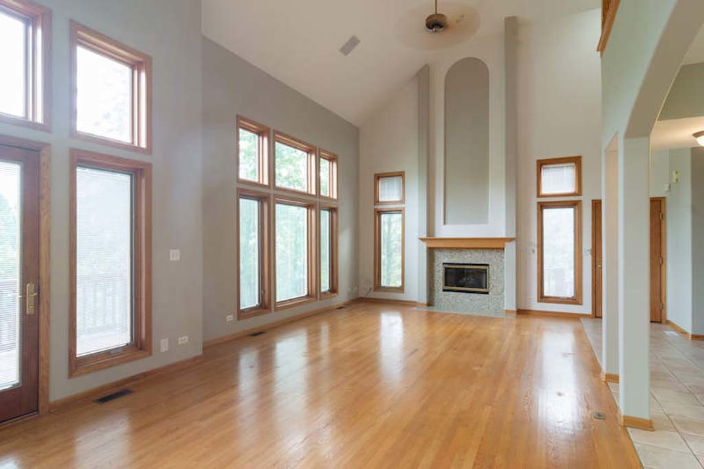 922 West Chesterfield Court Palatine, IL 60067 - Photo 13 of 19 a view of a livingroom with wooden floor and a fireplace