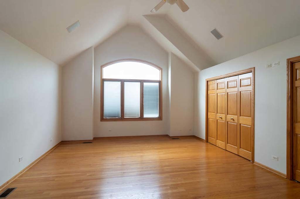 922 West Chesterfield Court Palatine, IL 60067 - Photo 14 of 19 an empty room with wooden floor and windows