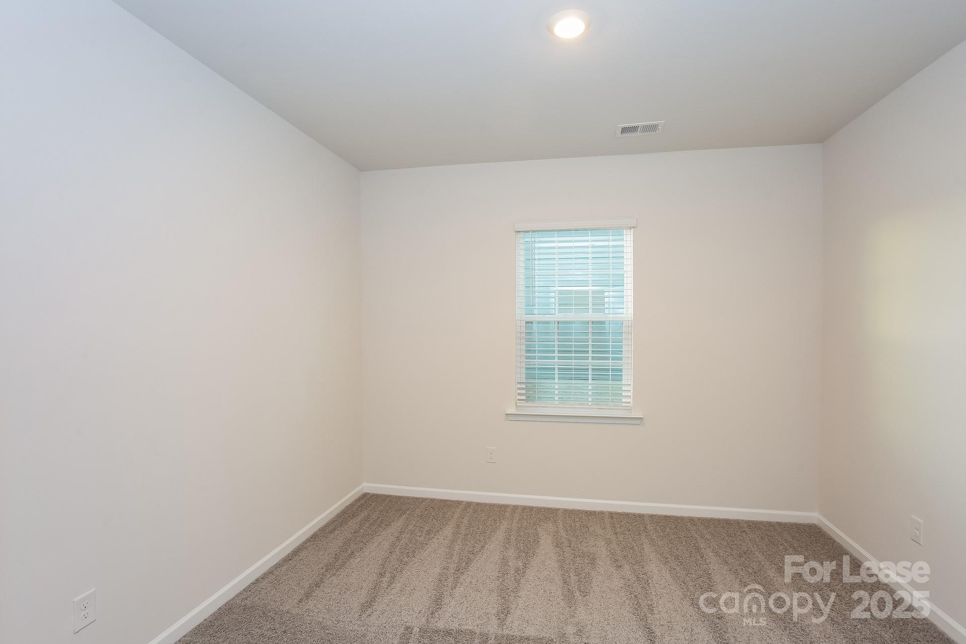 148 Way Cross Lane Troutman, NC 28166 - Photo 12 of 16 an empty room with a window