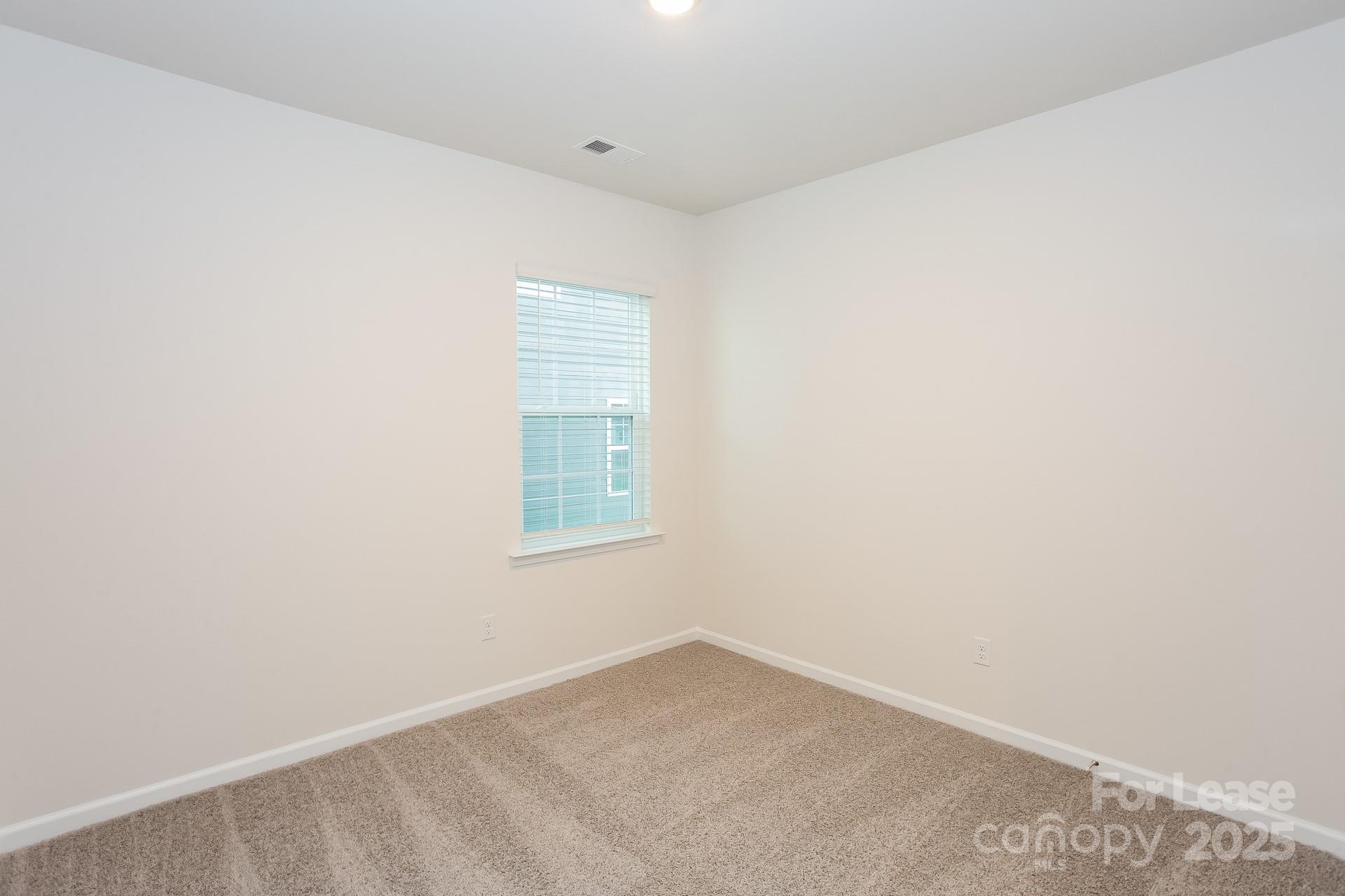 148 Way Cross Lane Troutman, NC 28166 - Photo 13 of 16 an empty room with a window