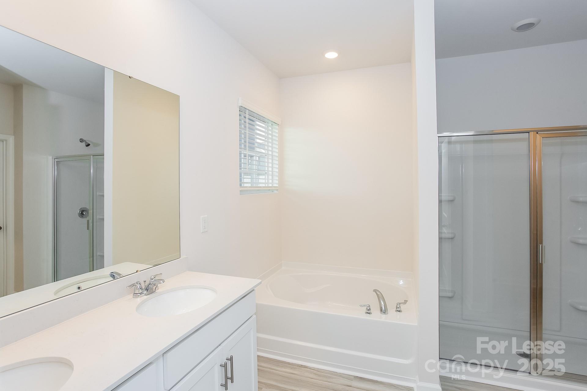 148 Way Cross Lane Troutman, NC 28166 - Photo 10 of 16 a bathroom with a granite countertop sink and a mirror