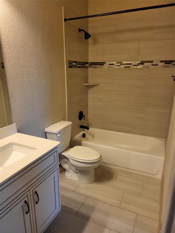 2229 Zenith Avenue Flower Mound, TX 75028 - Photo 11 of 18 a bathroom with a toilet and a shower