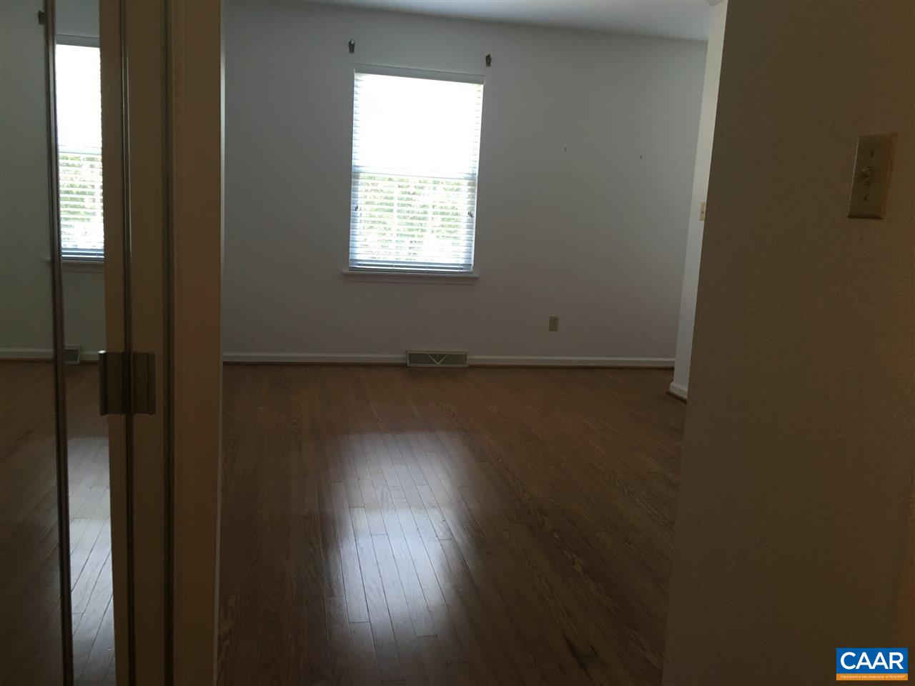 1650 Cool Spring Road Charlottesville, VA 22901 - Photo 17 of 24 a view of an empty room with wooden floor and a window
